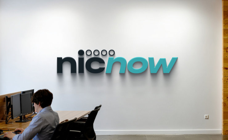 NicNow branding on wall in office