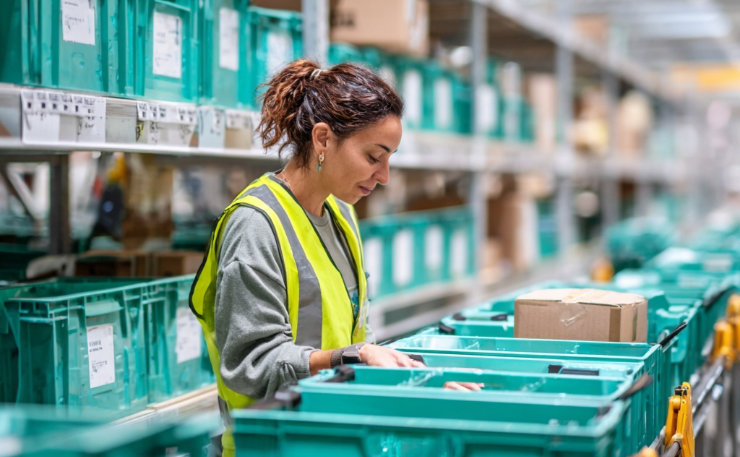 woman in NicNow warehouse picking an order